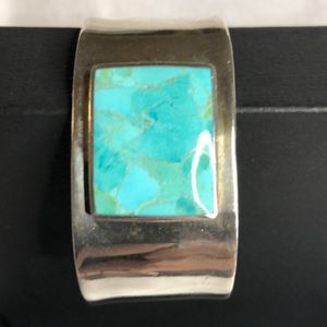 Silver cuff bracelet with turquoise center stone
